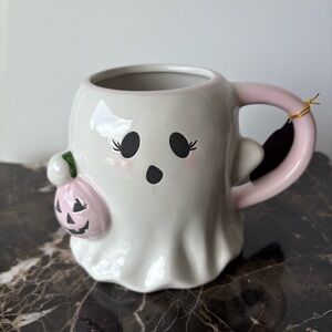Pink Ghost Mug Holding Pumpkin